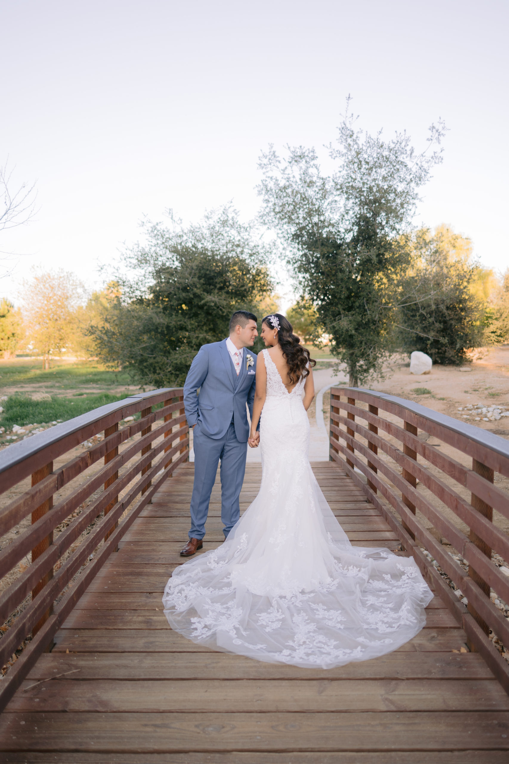 bride and groom portrait on bridge in redlands california