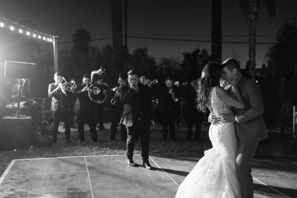 bride and groom first dance to banda la lujosa