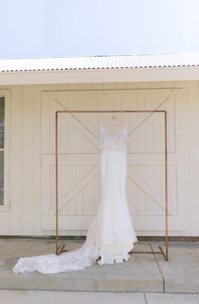 hanging dress photo with white barn doors