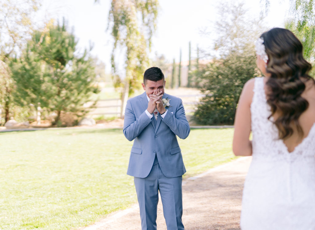 groom crying seeing his bride for the first time during a first look