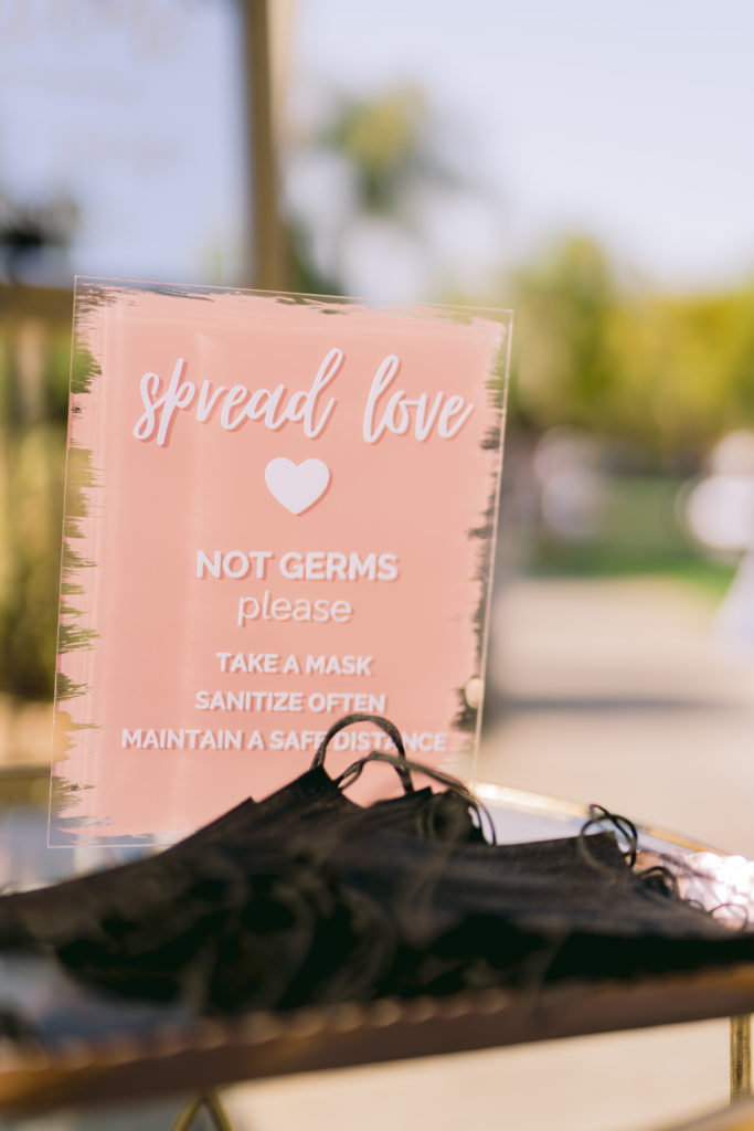 spread love not germs wedding sign