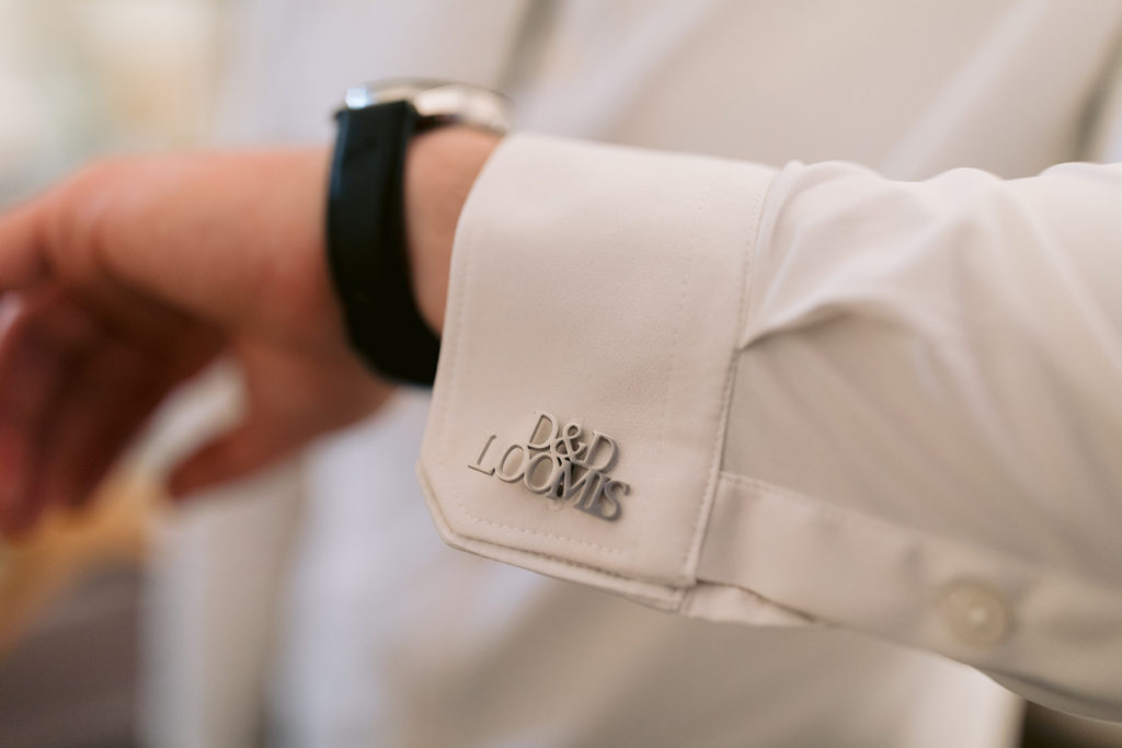 detail shot of groom's custom cufflinks