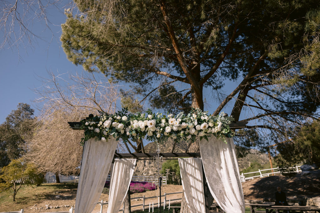 wide shot of a rustic wedding canopy