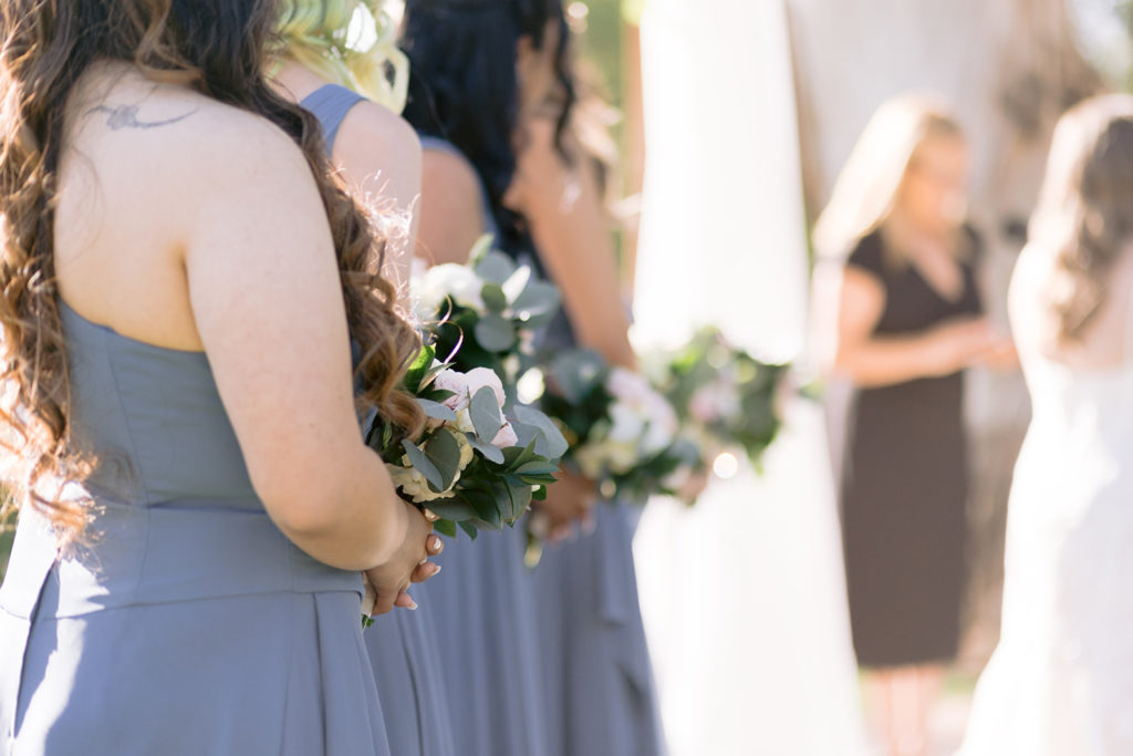 bridesmaid dress and bouquet for blue themed ranch wedding