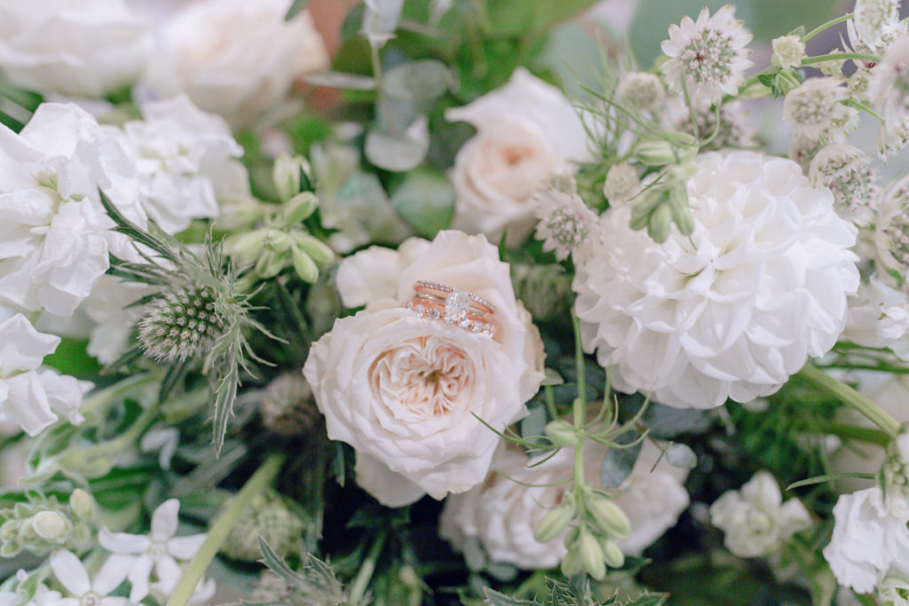 Detail shot of ring and bridal bouquet